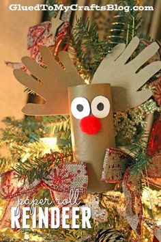 a paper reindeer ornament hanging from a christmas tree with the words ginger all reindeer written on it