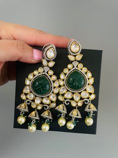 Sabyasachi inspired premium quality carved stone polki kundan earring in emerald green  and baby pink color. Inspire your style with this dual tone designer earring with premium polki kundan and american diamond with dome shaped small jhumkis. Adorn this classic and elegant jewelry for wedding, reception. cocktail or party.  Premium quality kundan is wrapped in pretty gold color with victorian finish American diamond details. Best quality of craftmanship.  All orders Ship same day if placed befo Kundan Temple Jewelry Earrings With Stone Work, Green Hand-set Chandbalis For Party, Green Cutdana Earrings For Wedding, Elegant Green Kundan Chandelier Earrings, Green Kundan Jhumkas Drop Earrings, Green Temple Jewelry Handset Earrings, Elegant Green Kundan Chandbalis, Green Cutdana Bridal Earrings For Party, Green Cutdana Chandbalis For Party