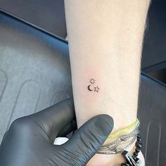 a person with a small tattoo on their arm