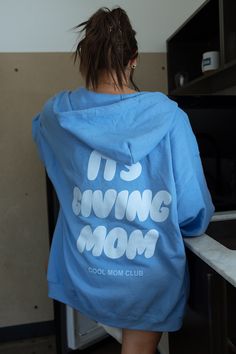 Its Giving Mom Cool Mom Club Carolina Blue Zip Up – where comfort meets style in the trendiest way possible! Its giving mom printed in white ink and cool mom club printed in light blue ink 💚👩‍👧‍👦 #MomClubChic #TrendyMomEssentials Karrie is wearing a size 2XL. Features 8 oz./yd² (US) 13.3 oz./L yd (CA), 50/50 cotton/polyester, 20 singles Classic fit Unlined hood with color-matched drawcord Metal zipper Overlapped fabric across zipper allows full front printing 1 x 1 rib with spandex for enhan Casual Light Blue Hoodie With Letter Print, Trendy Light Blue Cotton Hoodie, Trendy Mom, Cool Mom, Moms Club, Club Parties, Party Shop, Carolina Blue, Metal Zipper