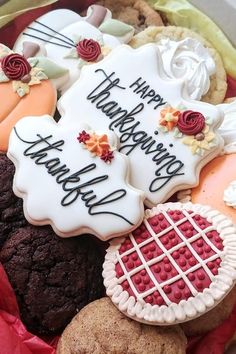 a basket filled with lots of decorated cookies