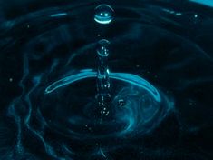 a blue sink with water running down it