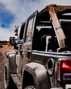 the back end of a jeep with its trunk open