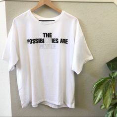 7 For All Mankind Graphic Oversized White Tee “The Possibilities Are Within” New With Tags, Has Never Been Worn! Women’s Size S Pit To Pit 26” Length 27” Oversized White Slogan Tops, Oversized Letter Print Athleisure Tops, Oversized Text Print Top For Athleisure, Athleisure Oversized Top With Text Print, Oversized Logo Print Tops For Everyday, Oversized Slogan Top For Athleisure, Oversized Athleisure Top With Slogan, White Tee, For All Mankind