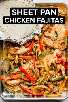 an easy sheet pan fajitas recipe with chicken, peppers and onions in foil