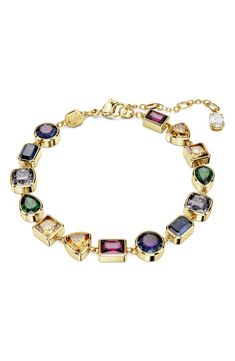 Dazzling mixed-cut crystals in bold hues add scintillating color to this goldtone bracelet that adds a elegant flourish to any look. 6 3/8" length; 1 1/2" extender; 1/4" width Goldtone plate/Swarovski zirconia Imported Swarovski Bracelet Gold, Swarovski Crystal Bracelet, Swarovski Bracelet, Aesthetic Shoes, Crystal Bracelet, Bracelet Gold, Crystal Bracelets, Swarovski Crystal, Swarovski Crystals