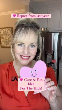 a woman holding up a sign that says cute & fun idea for the kids on valentine's day