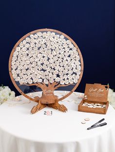 a table topped with a tree cut out of wood