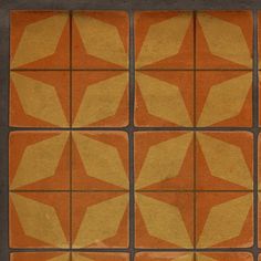 an orange and yellow tile pattern with squares