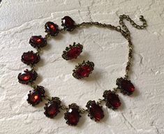 "Victorian shaped antiqued brass red glass stones necklace design just perfect to wear on your wedding day! We have added an extra long cable chain for you to adjust the length. Color: antiqued brass with red rhinestones crystals and glass stones Size: sparkle part measures around 15\" long x 0.9\" width ** Please note we need to take around 5 days to make it. Please be patient. ** Item ship out with tracking number to you (around 10 to 14 business days for delivery). We also provide fast shippi Red Garnet Necklace, Bronze Wedding, 1950s Jewelry, Wedding Red, Ruby Wedding, Fancy Wedding, Victorian Wedding, Prom Ideas, Necklace Bridal