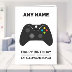 a card with a video game controller on it says, any name happy birthday eat sleep game repeat