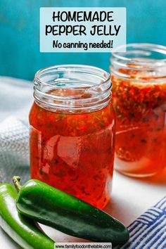 homemade pepper jelly in jars with green peppers on the side and blue towel next to it