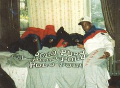 a man laying on top of a bed in a bedroom