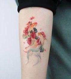 a woman's arm with a dog and flowers on it