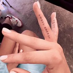 two people with their fingers in the shape of letters that spell out love and peace