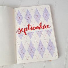 an open notebook with the word segitembie written in cursive writing