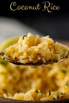 a spoon full of rice with the words coconut rice on it