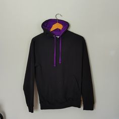 "All We Do Is" Black And Purple Hoodie Body Is Black And Inside Of Hoodie And Drawstrings Are Purple, Has A Nice Large Front Pocket Size Small Pit To Pit 19.5 Inches Length 25 Inches 80% Cotton And 20% Polyester Washed But Never Worn Purple Hoodie With Double-lined Hood And Long Sleeves, Purple Hooded Sweatshirt With Drawstring, Purple Sweatshirt For Winter Streetwear, Purple Long Sleeve Hoodie With Double-lined Hood, Purple Fleece Sweatshirt With Ribbed Cuffs, Streetwear Purple Hoodie With Double-lined Hood, Hooded Purple Sweatshirt For Streetwear, Purple Hooded Sweatshirt For Streetwear, Purple Hoodie With Double-lined Hood