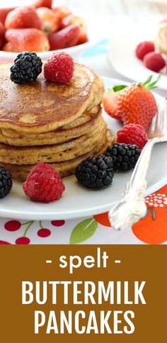 a stack of pancakes with berries on top and the words spell buttermilk pancakes