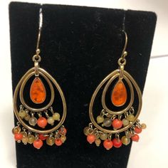 Liz Claiborne- Boho Style Vintage Hanging Earrings In Orange & Brown Beads With Gold Hardware Made Well In Great Condition Never Worn- Approximately 2” Drop Orange Dangle Chandelier Earrings For Gift, Orange Teardrop Jewelry With Colorful Beads, Orange Teardrop Earrings With Dangling Beads, Vintage Orange Beaded Earrings, Orange Beaded Vintage Earrings, Brown Rectangular Bohemian Earrings, Brown Bohemian Dangle Earrings, Nickel-free Orange Beaded Drop Earrings, Vintage Brown Earrings With Dangling Beads