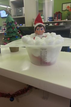 an elf is sitting in a bathtub filled with foam