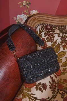 Everyone is sure to be mesmerized by your sense of style with the cute addition of the Lulus Captivating Aura Black Beaded Shoulder Bag! This stunning shoulder bag is covered with shiny beaded details (in varying shapes and sizes) that create a multitude of designs allover the rectangular silhouette. The front flap boasts a hidden magnetic closure that opens to reveal a roomy, lined interior with a sidewall pocket. Remove the detachable beaded shoulder strap when you want to style this bag as a Glamorous Sequined Shoulder Bag For Night Out, Chic Sequins Shoulder Bag For Night Out, Beaded Evening Shoulder Bag, Embellished Black Evening Shoulder Bag, Rectangular Sequin Shoulder Bag For Night Out, Rectangular Shoulder Bag With Sequins For Night Out, Chic Beaded Shoulder Bag For Party, Chic Beaded Crossbody Shoulder Bag, Black Evening Bag With Adjustable Strap For Party