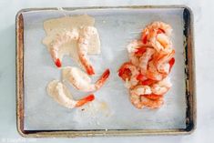 the shrimp is ready to be cooked on the baking sheet and put in the oven