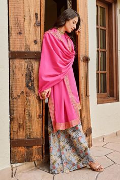 Pink kurta with placement stripe pattern. Paired with a floral print palazzo. Comes along with a dupatta.
Components: 3
Pattern: Print: Palazzo
Type Of Work: Floral
Neckline: Round Neck
Sleeve Type: Three Quarter Sleeves
Fabric: Chanderi, Cotton Mulmul 
Color: Pink
Other Details: 
Stripe border dupatta
Occasion: Sangeet - Aza Fashions Pink Kurta, Fashion App, Set For Women, Three Quarter Sleeves, Aza Fashion, Sleeve Type, Stripes Pattern, Three Quarter, Types Of Sleeves