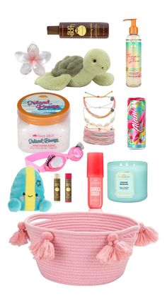 the contents of a pink basket are neatly arranged on top of each other, including items such as hairbrushes, soaps, toothpaste and more