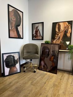 an office with three framed pictures and a chair in front of the chairs is shown