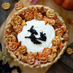 a halloween pie decorated with pumpkins and jack - o'- lanterns