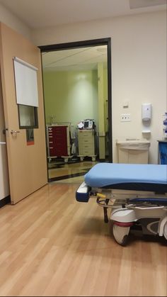 an empty hospital room with medical equipment on the floor