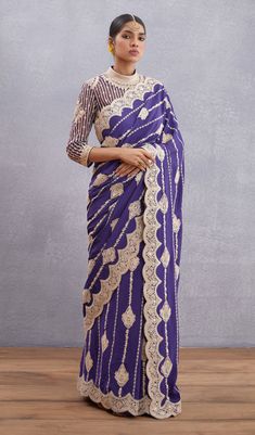 Editor's Note Featuring Jamuni Induma Blouse Note: Saree worn by model is for styling purposes and can be purchased separately. Color: Amethyst Purple Fabric: Net, Pure Cotton Silk Components: Blouse Care: Dry Clean Only About the Designer Torani by Karan Torani stands handcrafted luxury inspired by the myriad tales of Indian mythology. Torani is a potpourri of all things nostalgic that binds you with a memory long forgotten. The label works with and revives timeless Indian textiles and embroide Torani Designer, Indian Mythology, Purple Saree, Net Blouses, Indian Textiles, Indian Fashion Designers, Purple Fabric, Chiffon Saree, Amethyst Purple