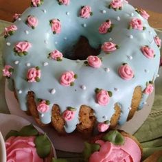 there is a frosted donut with pink flowers on it