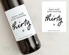 there is a bottle of wine with the words thirty written in black ink on it