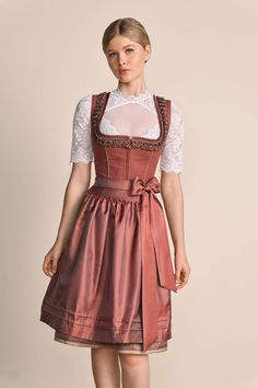 Description Item description Our chic dirndl Marielle is a dream come true for all our traditional costume lovers who want to combine a mix of classic elegance and tradition. The dirndl dress features romantic colors and traditional cuts. Dirndl Marielle is a classic eye-catcher thanks to its straight neckline with decorative frog-shaped trim along the neckline. The skirt impresses with its interesting diamond pattern. The shimmering apron adds a harmonious accent to the overall outfit. Our dirn Dirndl Blouse, Novelty Hats, Overall Outfit, Dirndl Dress, Romantic Colors, A Dream Come True, Candle Accessories, Traditional Costume, Dream Come True