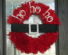 a red wreath with the word ho ho on it