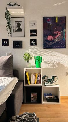 a bed room with a neatly made bed and a book shelf