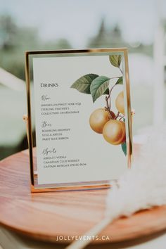 a menu card with apples on it sitting on a table