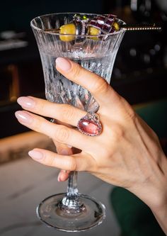 18.5 carats of a purplish pink Tourmaline cabochon from Brazil come together to form a one-of-a-kind cocktail ring, inspired by speakeasy bar vibes and reminiscent of a glass of rosé wine. Crafted by a family jewelry smith in Taipei, Taiwan 20 years ago, this stunning ring is guaranteed to be a true showstopper. Metal: this ring we offer white gold vermeil crafted with pure sterling silver. If you prefer to upgrade to 18k solid white or yellow gold, please send us a request, and we will provide you with the price for the item made with 18k solid gold. Gemstone: Pink Tourmaline Origin: Brazil Color: purplish pink Transparency: transparent  Treatment: natural color, not treated Stone weight: 18.5 ct Total weight: 11.2 Ring Size : size 7 (Able to resizing, please contact us) Feel free to mess Luxury Heirloom Tourmaline Jewelry, Luxury Pink Amethyst Ring For Gift, Luxury Pink Amethyst Ring As Gift, Luxury Pink Amethyst Gemstone Ring, Formal Pink Rings With Polished Finish, Luxury Pink Amethyst Ring For Formal Occasions, Luxury Pink Tourmaline Rings, Luxury Tourmaline Cabochon Rings, Luxury Pink Cabochon Jewelry