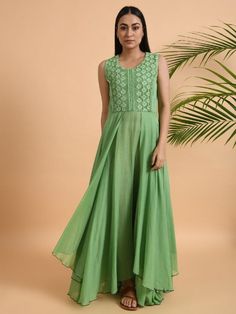 Green Lace Trimmed Double layered Dress By The Neem Tree now available at Trendroots Summer Anarkali Sleeveless Maxi Dress, Sleeveless Anarkali Maxi Dress For Summer, Sleeveless Embroidered Dress With Lace Trim For Spring, Summer Sleeveless Anarkali Maxi Dress, Embroidered Flowy Sleeveless Dresses, Flowy Sleeveless Embroidered Dress, Embroidered Sleeveless Flowy Dresses, Flowy Embroidered Sleeveless Dress, Elegant Sleeveless Dress With Chikankari Embroidery