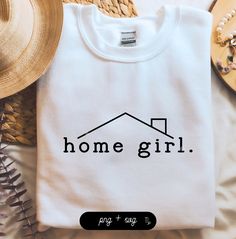 a t - shirt with the word home girl printed on it next to some straw hats