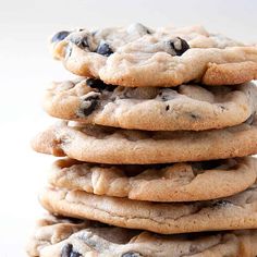 a stack of chocolate chip cookies sitting on top of each other