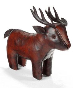 a wooden sculpture of a deer with antlers on it's head