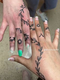 two people with matching tattoos on their hands