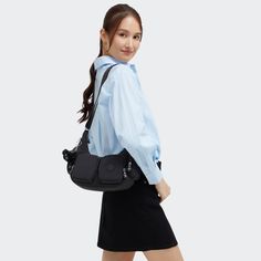 If you're a pocket lover, Rikka Small is the bag for you! Wear Rikka Small as a shoulder bag or crossbody and use the multiple zip pockets to keep your essentials in place. Rikka Small is the ideal day-to-day bag! Casual Satchel Camera Bag With Removable Pouch, Casual Camera Shoulder Bag With Detachable Strap, Trendy Crossbody Satchel With Multiple Pockets, Casual Crossbody Camera Bag With Cell Phone Pocket, School Crossbody Shoulder Bag With Multiple Pockets, On-the-go Camera Bag With Zipper Pocket, Casual Crossbody Camera Bag With Zipper Pocket, Shoulder Bag With Multiple Pockets For Daily Use, Trendy Crossbody Shoulder Bag With Multiple Pockets