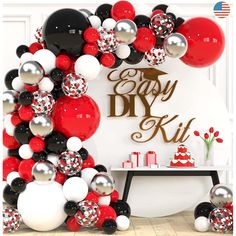 the balloon arch is decorated with black, white and red balloons for a party decoration