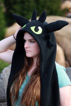 This listing is for an inspired Toothless or Light Fury Hat from How to Train your Dragon. Scoodies are made from a soft, warm fleece, either anti-pill or blizzard. The ears are stuffed with fiberfill to give the shape. - Hat measures about 33in from top of head to bottom of hand pockets. - One size fits all, but I can make the hand pockets shorter if you would like them to be fit for a child! * Made in a smoke free, smell good home! * Thank you for checking out this item and if you wish to see Light Fury Costume, Splatoon Hat, Hiccup Cosplay, Hiccup Toothless, Dragon Cosplay, Link Hat, Hair Without Heat, Hiccup And Toothless, Light Fury