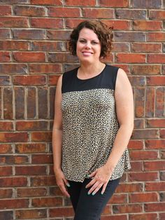 This Animal Print Sleeveless Swing Top in Black and Taupe top features a round neckline, and it is so soft and comfortable with a trendy animal print Enjoy the effortless style of this top, perfect for pairing with jeans or skirts to create a chic, sophisticated look. ABOUT THIS ITEM: Made in Mexico. Fabric is 95% Rayon / 5% Spandex. Contrast: 96% Polyester / 4% Spandex. Hand wash in cold water, hang or line dry. Model is 5'6, please see size chart. Casual Sleeveless Leopard Print Top, Casual Leopard Print Sleeveless Tank Top, Stretch Sleeveless Leopard Print Top, Chic Leopard Print Sleeveless Top, Effortless Style, Round Neckline, Cold Water, Animal Print, Happy Shopping