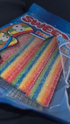 there are many different colored candy sticks in the package